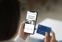 Choosing the Right Payment Gateway: PayPal Vs Alternative Solutions A woman holding a smartphone and a credit card, trying to make a payment online.